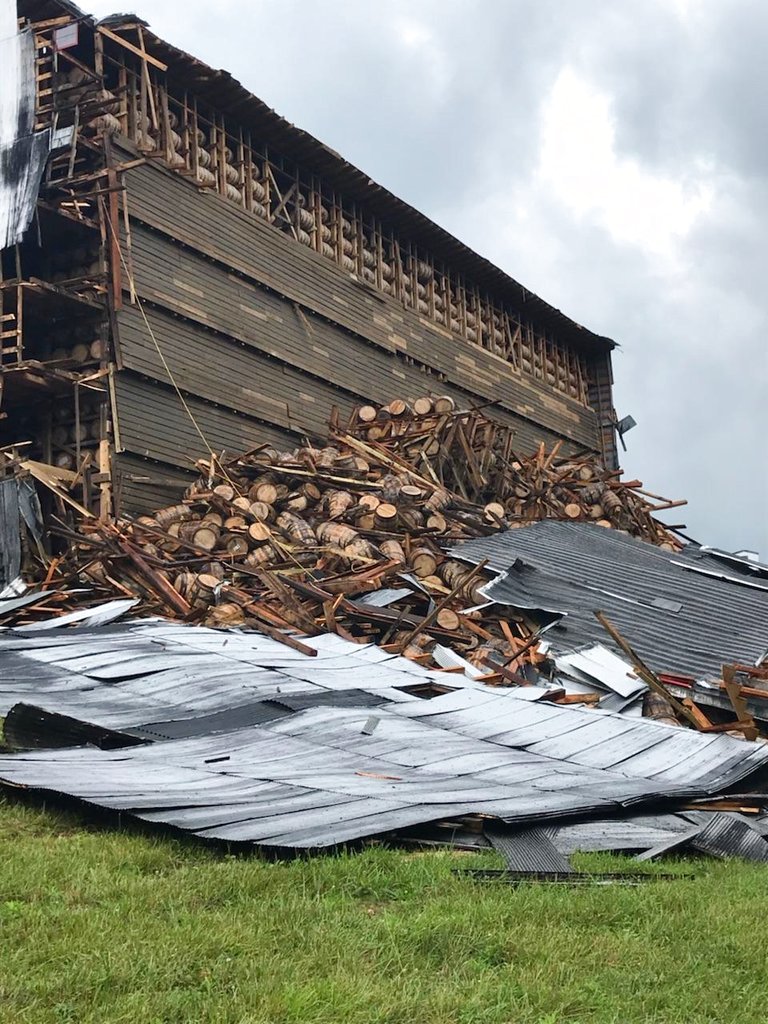 In this image provided by the Bardstown, Ky., Fire Department, debris is piled in a heap after a section of a bourbon storage warehouse at the Barton 1792 Distillery collapsed, Friday June 22, 2018, in Bardstown, Ky. Nelson County Emergency Management spokesman Milt Spalding says about 9,000 barrels filled with aging bourbon were affected. (Chief Billy Mattingly/Bardstown Fire Department via AP)