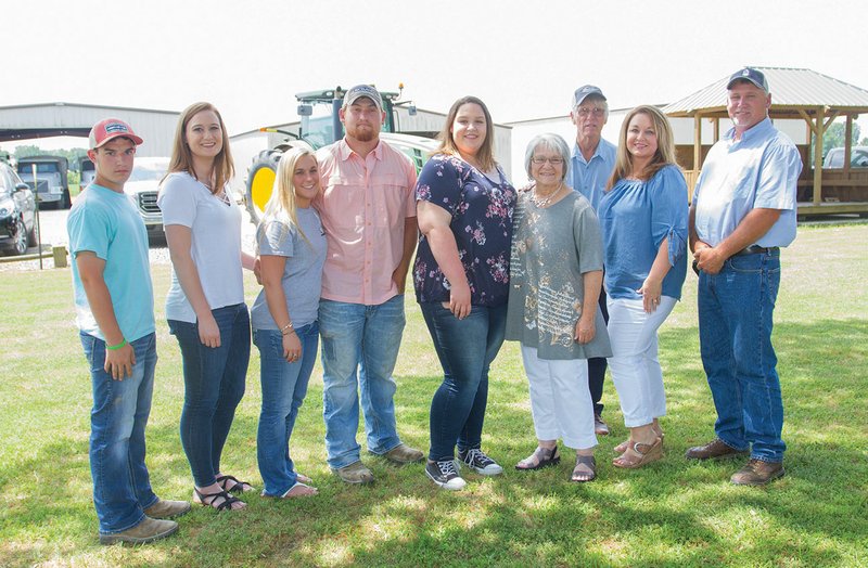 The Shannon Feather Family of Higginson, owners of Conant Crops Inc., is the 2018 White County Farm Family of the Year. Pictured are, from left, Josh Qualls and Kyla, Lynley, Luke, Abby, Ahnean, Thomas, Tami and Shannon Feather.