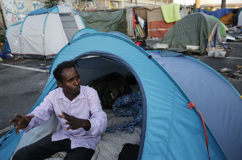 An asylum seeker from the Horn of Africa who did not want to be identified by name sits in a tent camp on the outskirts of Rome that was set up by an aid group.  
