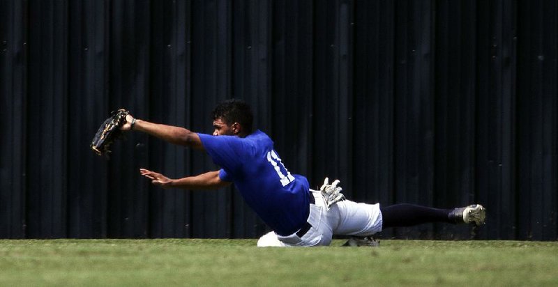 The East’s Trey Harris makes a diving catch for an out during the first game of the Arkansas High School Coaches Association All-Star baseball game on Friday at the University of Central Arkansas’ Bear Stadium in Conway. The East won the first game 3-1 and the second 4-2. 