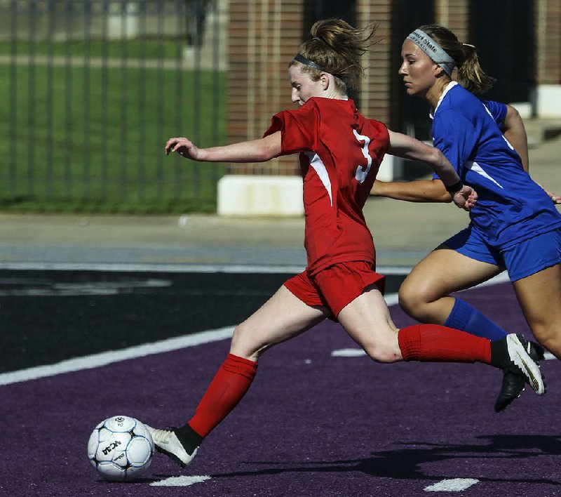 The West’s Skylurr Patrick (left) scored twice to help the team beat the East 6-4 on Friday in the Arkansas High School Coaches Association Girls’ All-Star soccer game at the University of Central Arkansas’ Estes Stadium in Conway. 