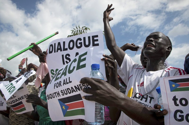 South Sudanese people cheer as they await the arrival back in the country of South Sudan's President Salva Kiir, at the airport in Juba, South Sudan Friday, June 22, 2018. The latest attempt at ending South Sudan's five-year civil war failed Friday as President Salva Kiir rejected working again with rival Riek Machar after their first face-to-face meeting in almost two years. (AP Photo/Bullen Chol)
