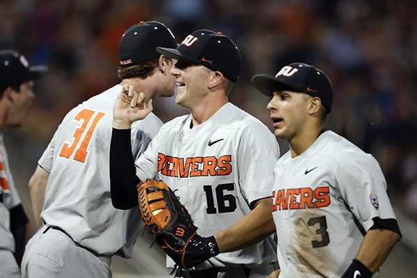 Oregon State first baseman Zak Taylor (16) smiles after a double play against Mississippi State ended the sixth inning of an NCAA College World Series baseball elimination game in Omaha, Neb., Saturday, June 23, 2018. (AP Photo/Nati Harnik)

