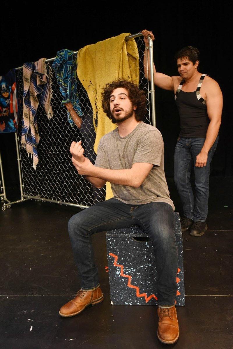 NWA Democrat-Gazette/FLIP PUTTHOFF Fernando Valdez (left) sings in Spanish June 13 while on stage with Damian Dena during a rehearsal at Northwest Arkansas Community College.