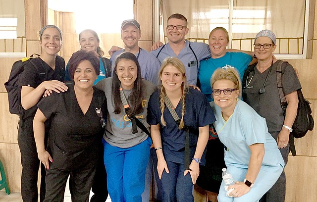 Photo submitted A team of 10 people from the Siloam Springs area traveled with Dustin's Dream to help at the Heart of Love Clinic in Guatemala City. Pictured are (front left) dental assistant Eva Hicks, translator Ana Castillo, Danae Chamberlain, nurse Carrie Stock, (back row) nurse practitioner Sara McCord, Kambryn Duncan, Dr. Carl Duncan, dentist Dr. Trent McCord, Jodi Klassin and nurse Deondra Chamberlain.