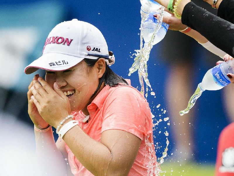 Supporters pour water on Nasa Hataoka after she won the LPGA Northwest Arkansas Championship on Sunday at the Pinnacle Country Club in Rogers. Hataoka shot an 8-under par 63, finishing with a tournament-best 21-under 192, three better than the mark set last year by So Yeon Ryu. 