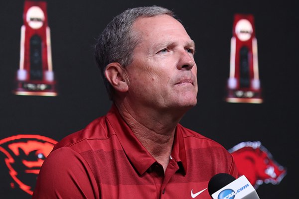Arkansas coach Dave Van Horn listens to a question during a news conference Sunday, June 24, 2018, at the College World Series in Omaha, Neb.