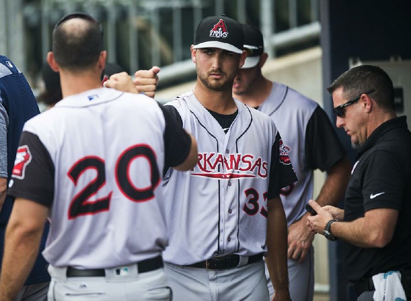 NWA Democrat-Gazette/CHARLIE KAIJO Arkansas Travelers pitcher Chase De Jong (33) returns to the dugout after a score during a baseball game, Sunday, June 17, 2018 at Arvest Ballpark in Springdale.

