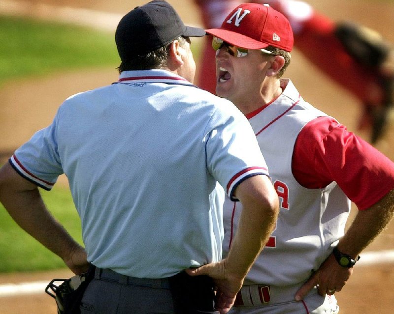 Then-Nebraska coach Dave Van Horn argues with home plate um- pire Joe Burleson on June 1, 2002, in an NCAA regional game against Marist in Lincoln, Neb. Van Horn resigned at Nebraska five days after the season to replace Norm DeBriyn as the Arkansas Razorbacks coach. (AP Photo/Dave Weaver)