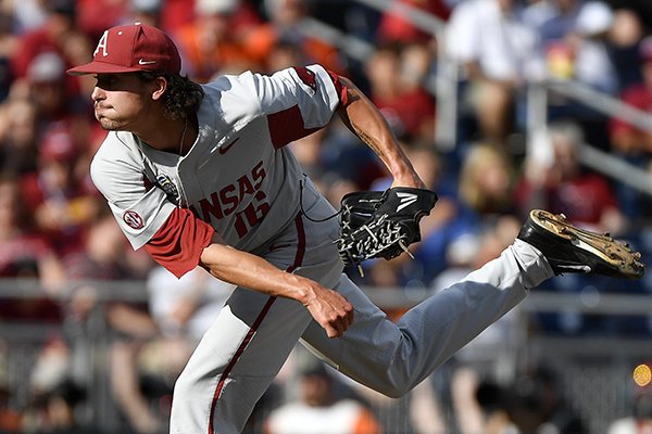 Arkansas pitcher Blaine Knight throws against Oregon State during the first inning of Game 1 of the NCAA College World Series baseball finals in Omaha, Neb., Tuesday, June 26, 2018. (AP Photo/Ted Kirk)


