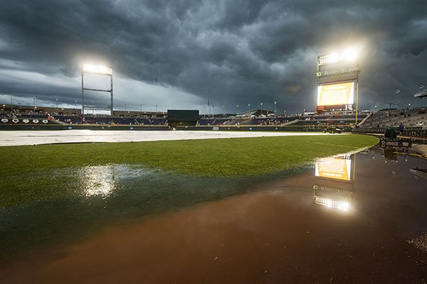 Water stands on the field at TD Ameritrade Park on Monday, June 25, 2018, Omaha, Neb. The first game of the College World Series finals between Arkansas and Oregon State was postponed until Tuesday. 
