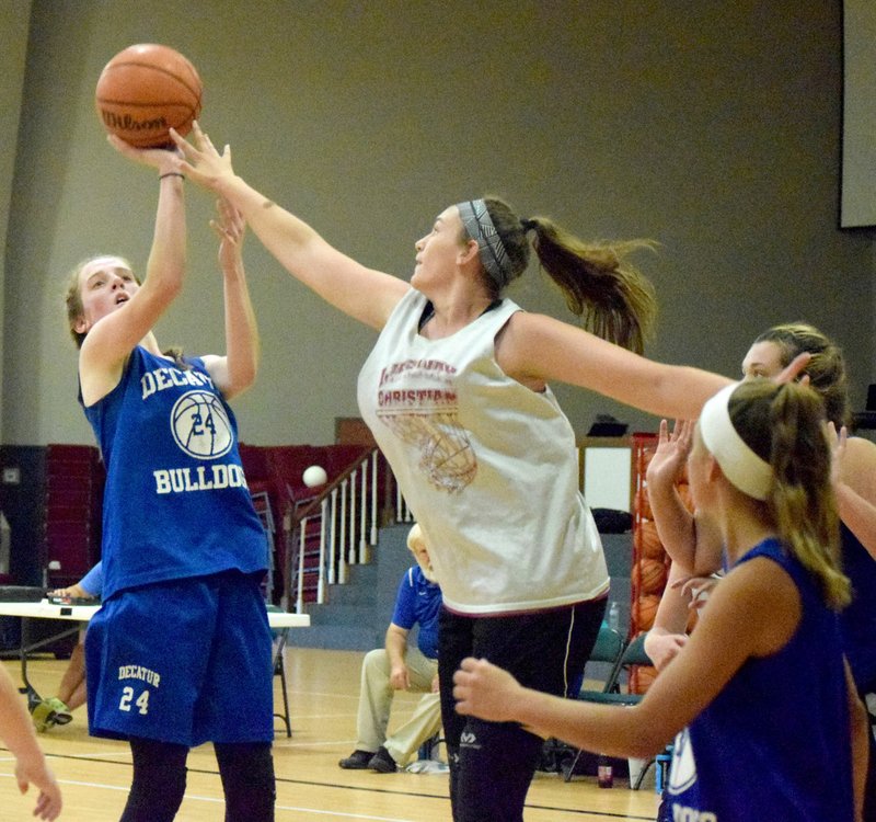 Special to the Westside Eagle Observer/DESI MEEK Decatur's Sammie Skaggs tries to put a shot over a Lady Warrior defender during the fifth quarter scrimmage game between Decatur and Life Way in Centerton June 21.
