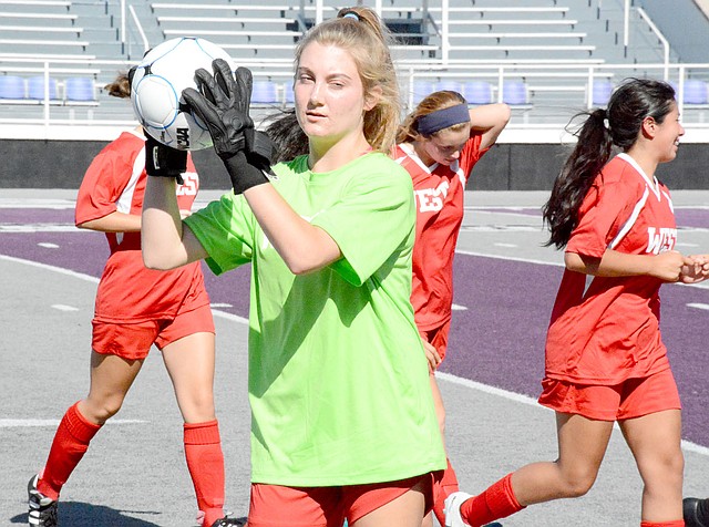 Graham Thomas/Herald-Leader Siloam Springs' Sydney Bomstad catches a ball as she comes off the field after pre-game introductions before the Arkansas High School Coaches Association All-Star Girls Soccer Match last Friday at Estes Stadium in Conway.