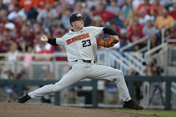 Oregon State pitcher Kevin Abel (23) throws against Arkansas during the eighth inning of Game 3 in the NCAA College World Series baseball finals, Thursday, June 28, 2018, in Omaha, Neb. (AP Photo/Nati Harnik)

