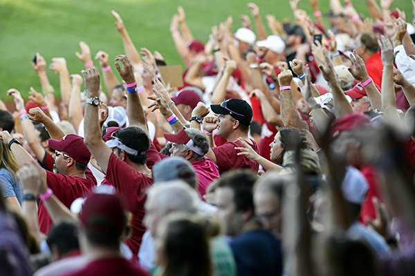Arkansas fans do the hog call in Game 2 of the NCAA College World Series baseball finals in Omaha, Neb in Omaha, Neb., Wednesday, June 27, 2018. Oregon State won 5-3. (AP Photo/Ashley Pales)