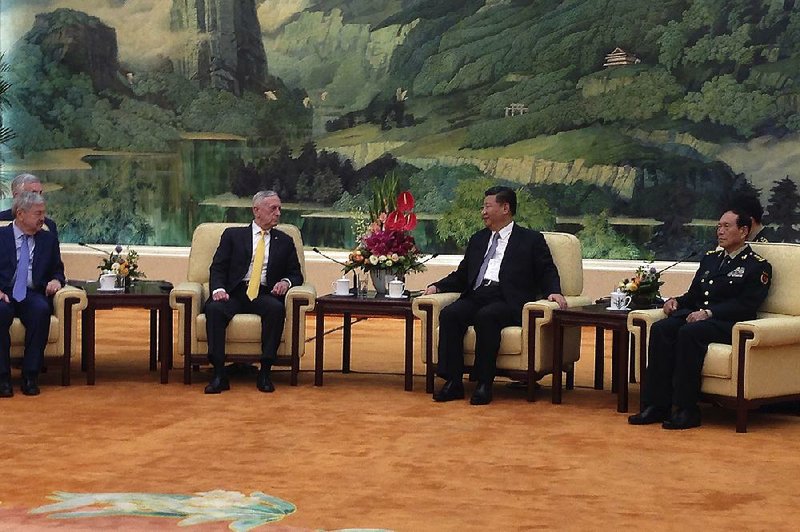 U.S. Defense Secretary Jim Mattis (third from right) talks Wednesday with Chinese President Xi Jinping in the Great Hall of the People in Beijing.  