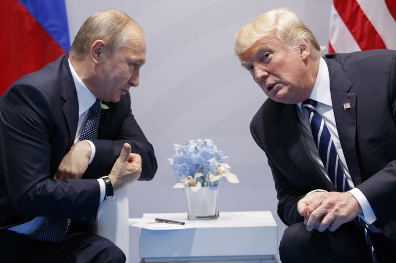 FILE - In this Friday, July 7, 2017, file photo U.S. President Donald Trump meets with Russian President Vladimir Putin at the G-20 Summit in Hamburg. The Kremlin and the White House have announced Thursday June 28, 2018, that a summit between Russian President Vladimir Putin and U.S. President Donald Trump will take place in Helsinki, Finland, on July 16. (AP Photo/Evan Vucci, FILE)