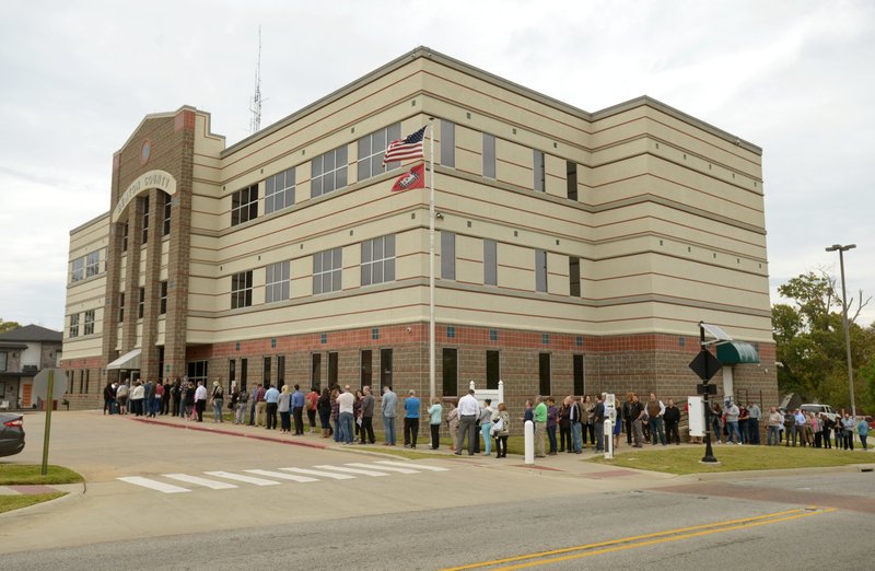NWA Democrat-Gazette/BEN GOFF @NWABENGOFF
A line of voters snakes around the block on Monday Nov. 7, 2016 at the Benton County Administration Building in Bentonville. 