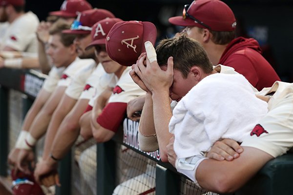 Arkansas players react after the final out of the College World Series championship game against Oregon State on Thursday, June 28, 2018, in Omaha, Neb. The Razorbacks lost 5-0.