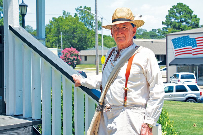 Former Benton Mayor Lynn Moore, dressed as William Lockhart, the founder of the first settlement in Saline County, stands on the steps of the gazebo in front of the Saline County Courthouse in Benton. Moore is scheduled to be the guest speaker at the second annual Historical Summit on Saturday. 