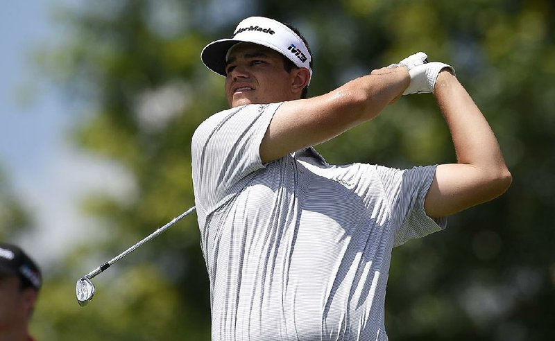 Beau Hossler watches his tee shot on the 17th tee during the second round of the Quicken Loans National golf tournament, Friday, June 29, 2018, in Potomac, Md. 