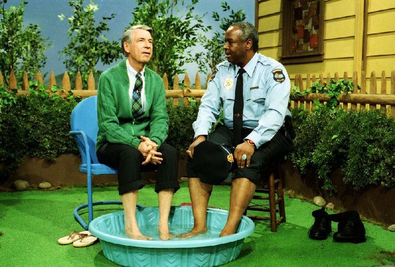 Fred Rogers and Francois Scarborough Clemmons cool their feet on the set of Mister Rogers’ Neighborhood in Morgan Neville’s documentary Won’t You Be My Neighbor? 

