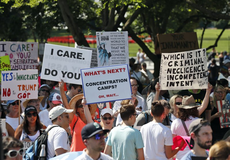 Activists gather to protest the Trump administration's approach to illegal border crossings and separation of children from immigrant parents in Lafayette Square across from the White House, Saturday, June 30, 2018, in Washington. (AP Photo/Alex Brandon)

