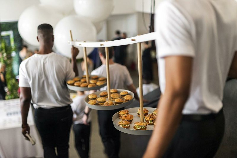 Traveling trays of sliders, meant to circulate at a wedding, were made by Pinch Food Design June 8 in New York. 