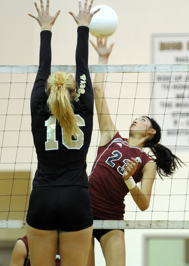 MARC F. HENNING THE MORNING NEWS Siloam Springs' Lizzy Briones, right, hits past Bentonville's Melissa Bakke during the third game of the Lady Panthers' match against the Lady Tigers on Tuesday, Aug. 25, 2009, in Bentonville.