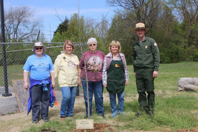 Courtesy photo The Garden Club of Rogers recently planted a tree to mark Arbor Day. The club plants a tree every year in public places around the Rogers area. Last year they planted a tree at Lake Atalanta; this year they planted a pin oak at the Corps of Engineers office on North Second Street. Pictured are club members Cindy Anderson (from left), Carol McCutcheon, club president Marge Leonard, Cathy Patterson and Corps representative Michael A. Hurley.