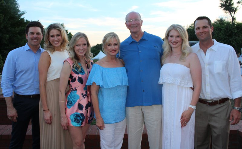 NWA Democrat-Gazette/CARIN SCHOPPMEYER Shane Allison and Meredith Counce (from left), Natalie Counce, Kathy and Jim Counce and Jennifer and Bo Wilkins welcome guests to the Counce home in Springdale for the Hospice Summer Garden Party on June 16.