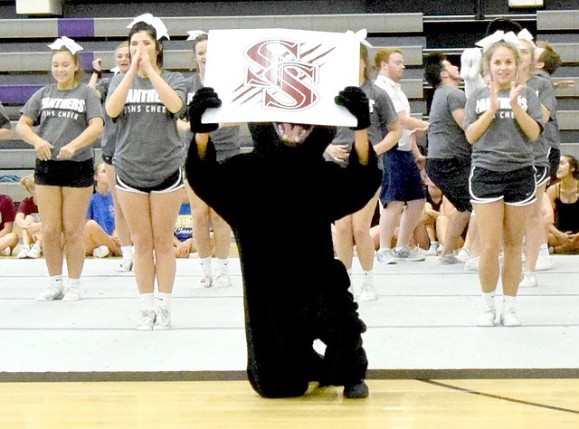 Mike Eckels/Westside Eagle Observer Siloam Springs cheerleaders perform a stunt during Universal Cheer Association Camp at Fayetteville High School on Saturday, June 23.