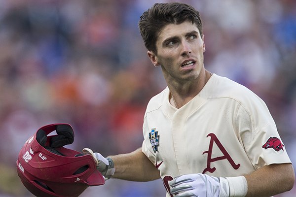 Arkansas second baseman Carson Shaddy walks to the dugout during a College World Series championship game against Oregon State on Thursday, June 28, 2018, in Omaha, Neb.