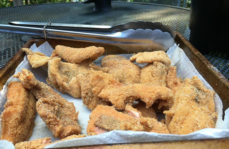 NWA Democrat-Gazette/FLIP PUTTHOFF 
A mess of fried trout combined with vegetables   June 23 2018   from the garden is a delicious way to live off the land, for one meal at least.