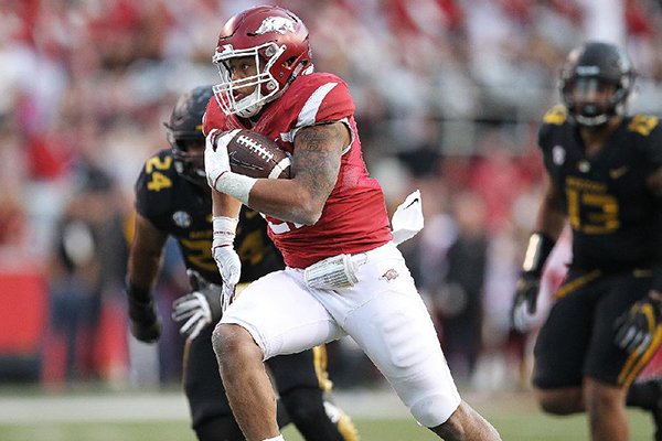 Arkansas Democrat-Gazette/THOMAS METTHE -- 11/24/2017-- Arkansas running back Devwah Whaley (21) runs for a 28-yard touchdown run during the third quarter of the Razorbacks' 48-45 loss to Missouri on Saturday, Nov. 24, 2017, at Reynolds Razorback Stadium in Fayetteville. 