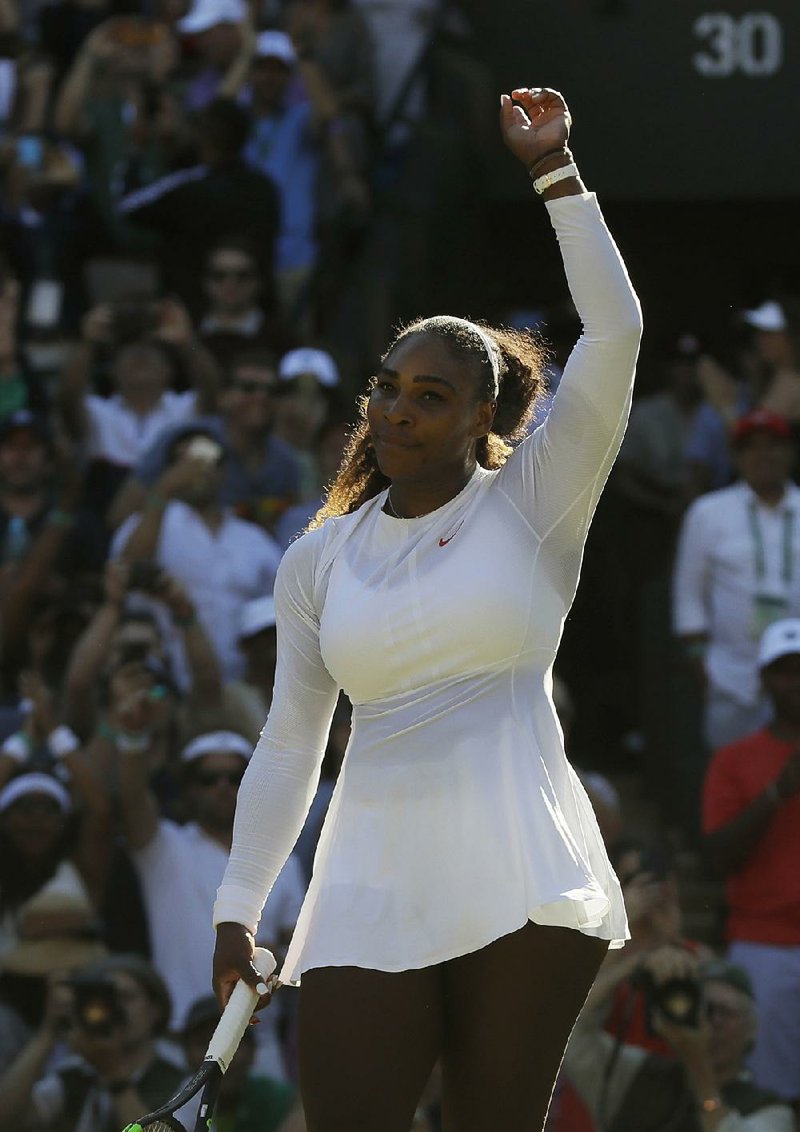 Serena Williams of the US celebrates defeating Arantxa Rus of the Netherlands during the Women's Singles first round match at the Wimbledon Tennis Championships in London, Monday July 2, 2018.