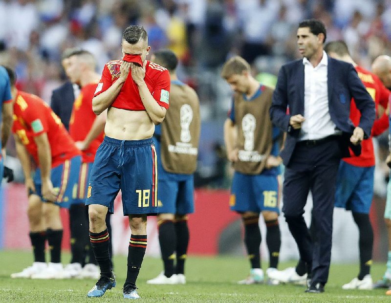 Spain’s Jordi Alba (left) reacts after losing in a penalty-kick shootout to Russia. After going into the World Cup as a favorite, Spain faces a lot of hard questions about how it lost, what went wrong and who deserves the blame.  