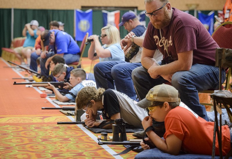 NWA Democrat-Gazette/CHARLIE KAIJO Competitors finish the prone position shooting during the Daisy Championship at the John Q. Hammons Center in Rogers.