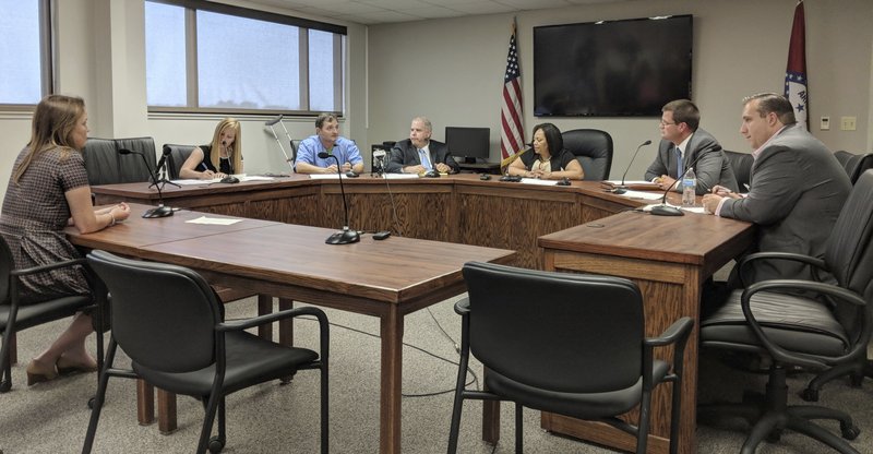 The Arkansas Medical Marijuana Commission meets Monday, July 2, 2018, to discuss options for hiring an independent consultant to review about 230 dispensary applications for 32 spots In Little Rock. A consultant would delay the launch of Arkansas' medical marijuana initiative, but would also help allay public concerns after allegations of impropriety which arose during a previous licensing process. (AP Photo/Hannah Grabenstein)
