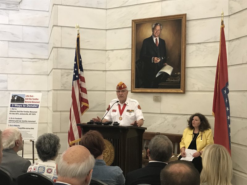 Paul Garrett, co-chairman of the Gold Star monument committee, speaks at a news conference Tuesday at the state Capitol.