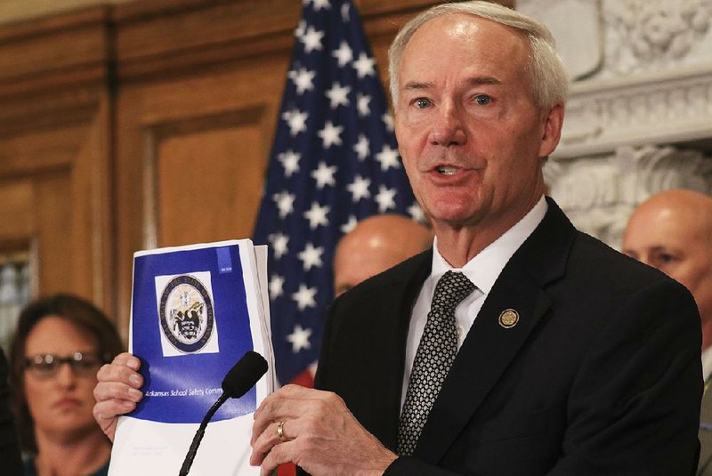 “Existing school personnel” will form safety teams for each school, Gov. Asa Hutchinson said Tuesday at the state Capitol. He said later that he was “open” to the idea of the state providing some funds for student mental health services.  