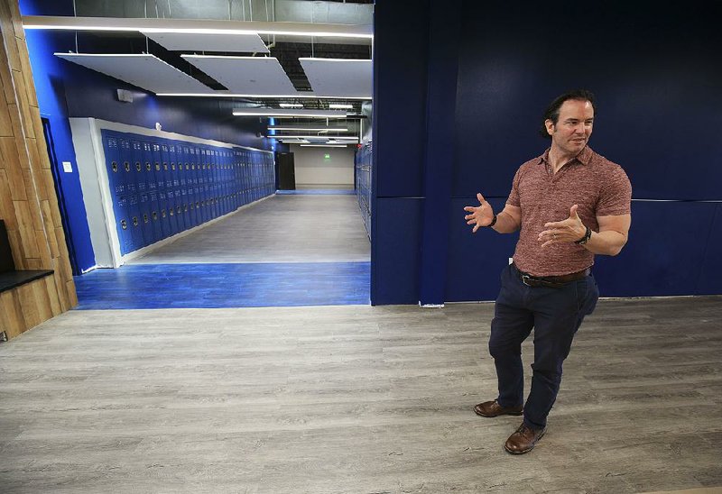 John Bacon, chief executive officer of eSTEM Public Charter Schools Inc., shows off the latest eSTEM elementary and junior high schools, in 120,000 square feet of converted warehouse space in the East Village area of Little Rock. The charter schools are to open July 24.  