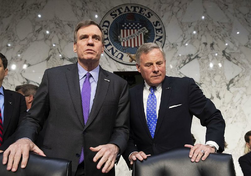 Senate Intelligence Committee Vice Chairman Mark Warner, D-Va., left, and Sen. Richard Burr, R-N.C., the panel chairman, are shown on Capitol Hill in Washington, Wednesday, May 9, 2018.