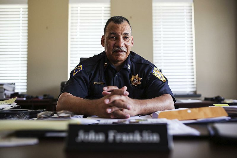 Jacksonville Police Chief John Franklin sits in his office Sunday. Since joining the force a month ago, he has worked to ease tensions in the department.  