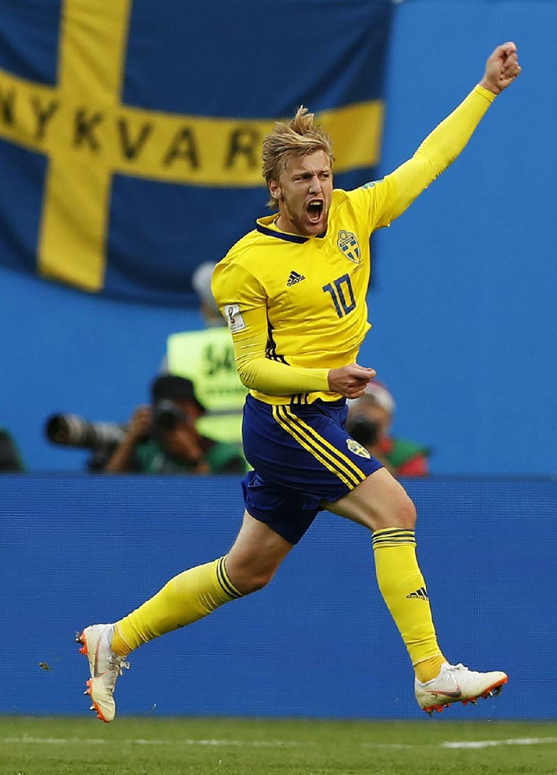 Sweden's Emil Forsberg celebrates after scoring the opening goal during the round of 16 match between Switzerland and Sweden at the 2018 soccer World Cup in the St. Petersburg Stadium, in St. Petersburg, Russia, Tuesday, July 3, 2018. 