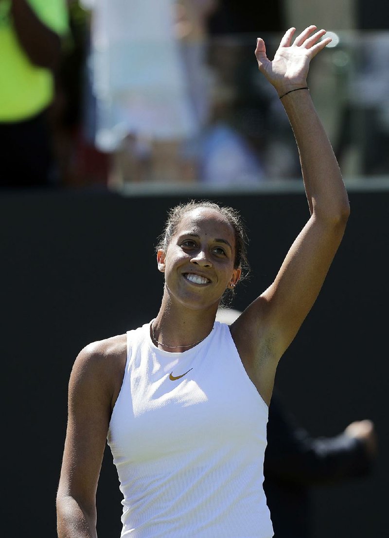 Madison Keys of the US celebrates defeating Ajla Tomljanovic of Australia during the Women's Singles first round match at the Wimbledon Tennis Championships in London, Monday July 2, 2018. 