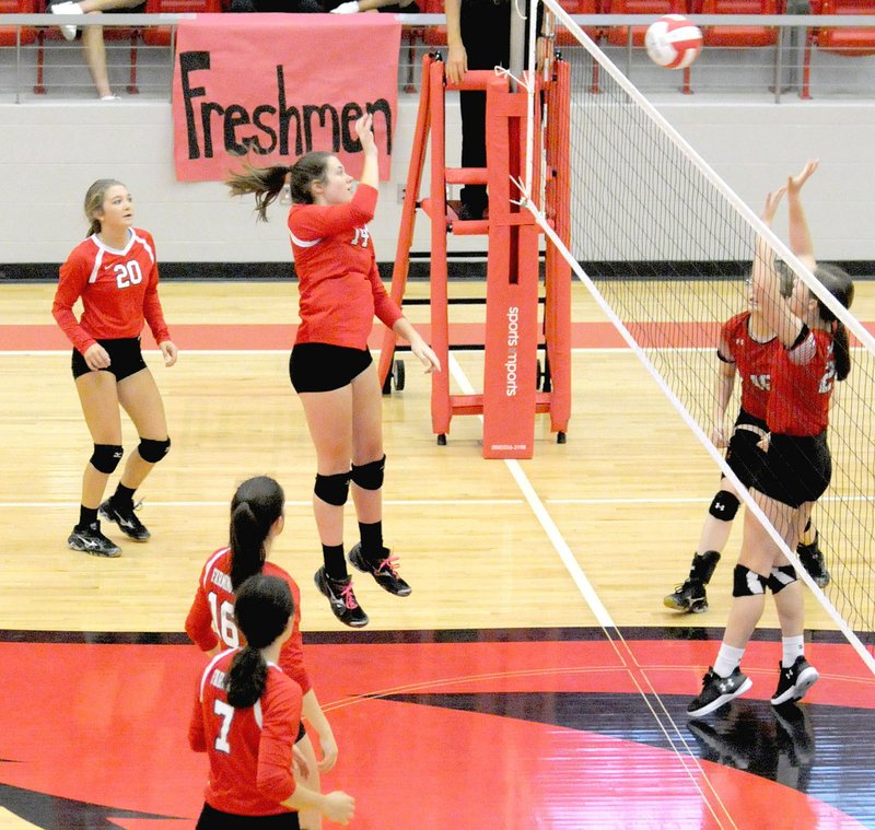 MARK HUMPHREY ENTERPRISE-LEADER Farmington 2018 graduate Ella Wilson, a middle blocker/hitter, plays the ball over the net against Clarksville. The Lady Cardinals swept the visitors 3-0 Tuesday, Oct. 3, 2017. A day earlier Wilson became the All-time leader in block-kills when she recorded 3 in a match against Huntsville.