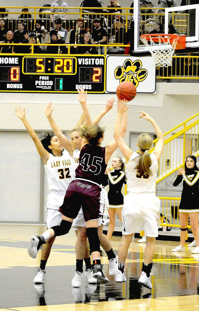 MARK HUMPHREY ENTERPRISE-LEADER Lincoln junior Jessica Goldman, shown driving the lane at Prairie Grove, earned All-Conference honors for the Lady Wolves during her junior basketball season. The 5-10 forward could handle the ball and shoot from the perimeter. Her size and ability to drive created match-up problems for opponents. Goldman averaged 13 points-per-game and 4-rebounds-per-game.