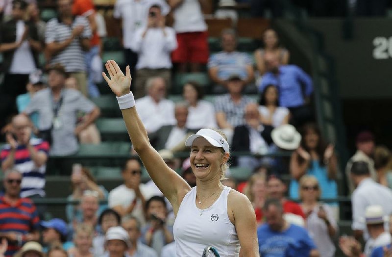 Ekaterina Makarova of Russia celebrates defeating Caroline Wozniacki of Denmark in their women's singles match on the third day at the Wimbledon Tennis Championships in London, Wednesday July 4, 2018.