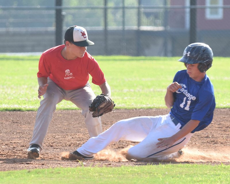 Rick Peck/Special to McDonald County Press McDonald County second baseman Josh Parsons tags out a Carthage runner attempting to steal second base in McDonald County's 9-4 win on June 27 at MCHS.